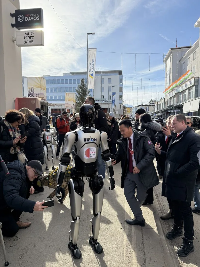 ILLEON-branded A2 Ultra walking through a crowd of press and attendees at the Davos World Economic Forum